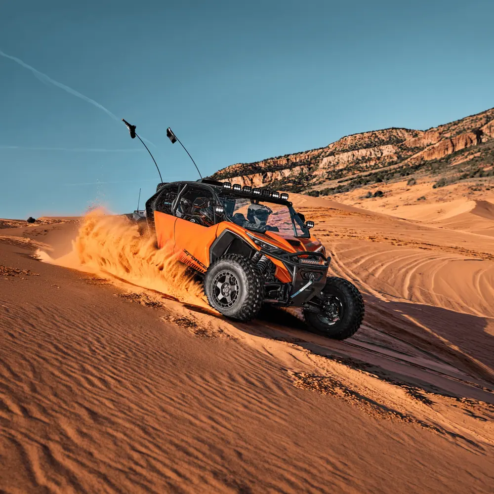 CFMOTO ZForce UTV ripping through desert sand